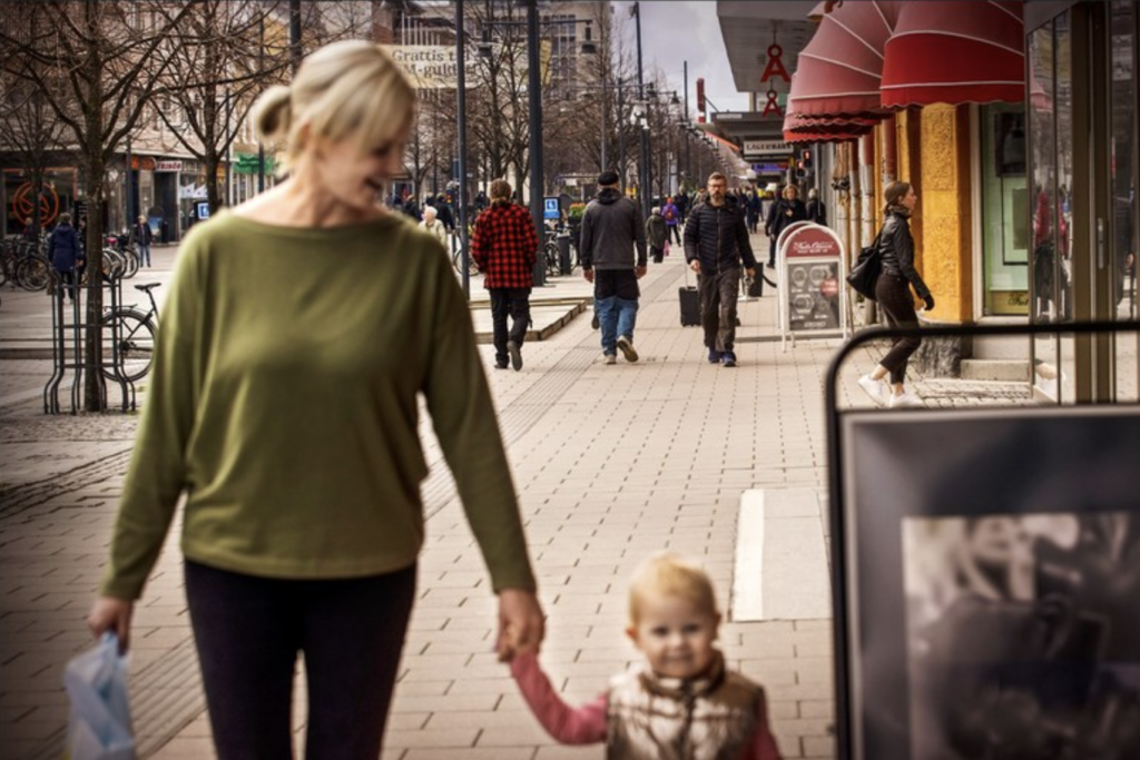 Woman and a small child in Luleå center shopping street.