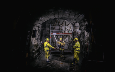 Workers with helmets down in a mine.